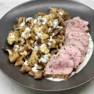 Garlic Cauliflower Potato and Mushrooms on a plate with seared pork loin